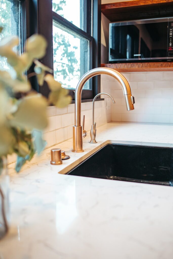kitchen white marble countertop golden faucet