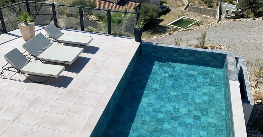 small pool with sunbeds