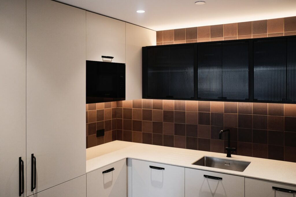 black flat screen tv on white wooden cabinet